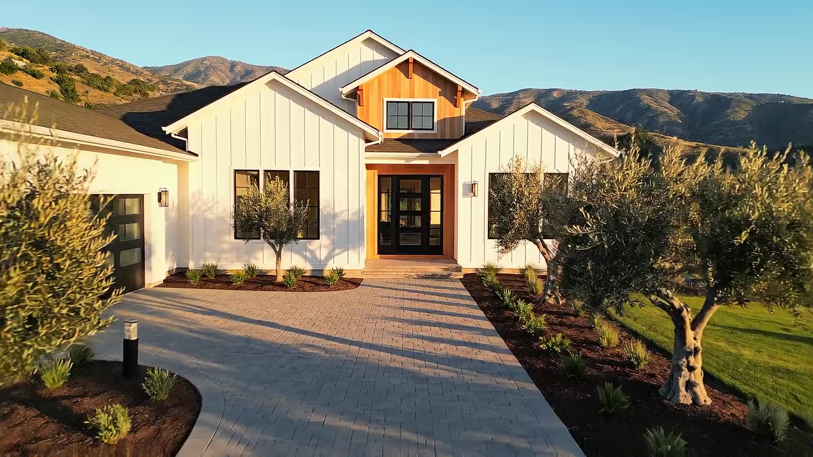 Renovated modern farmhouse home at golden hour — MAD Realty Co.